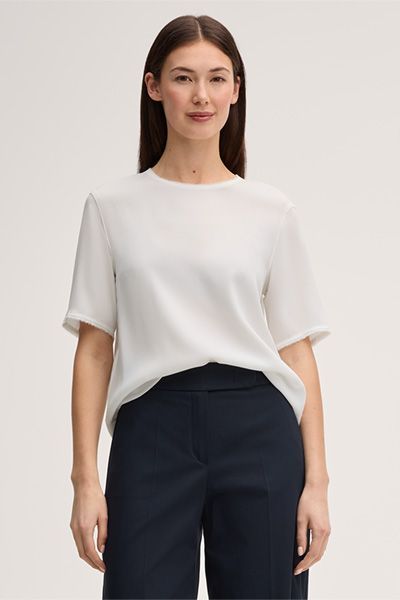 Elegante Rundhalsbluse mit Fransensaum