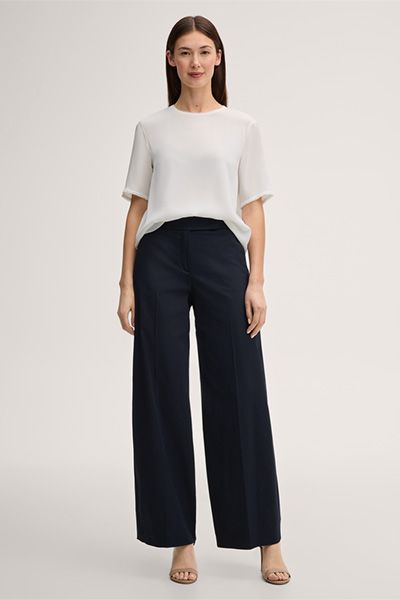 Elegante Rundhalsbluse mit Fransensaum