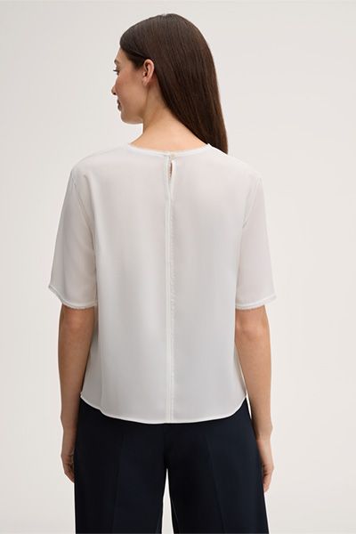 Elegante Rundhalsbluse mit Fransensaum