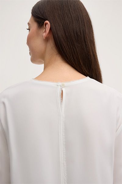 Elegante Rundhalsbluse mit Fransensaum
