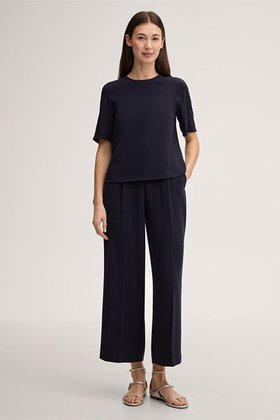 Minimalistische Krepp-Bluse mit Fransensaum