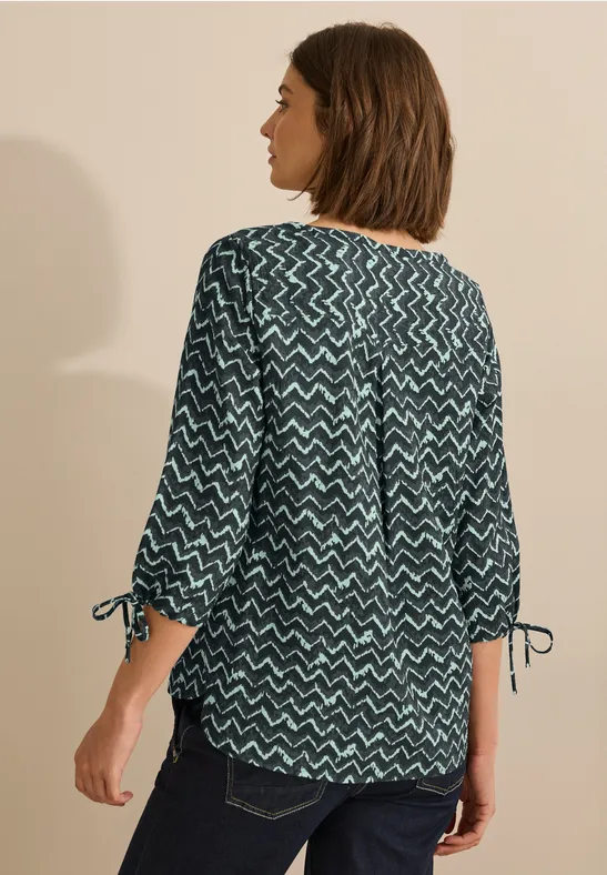 Bluse mit abstraktem geometrischem Muster