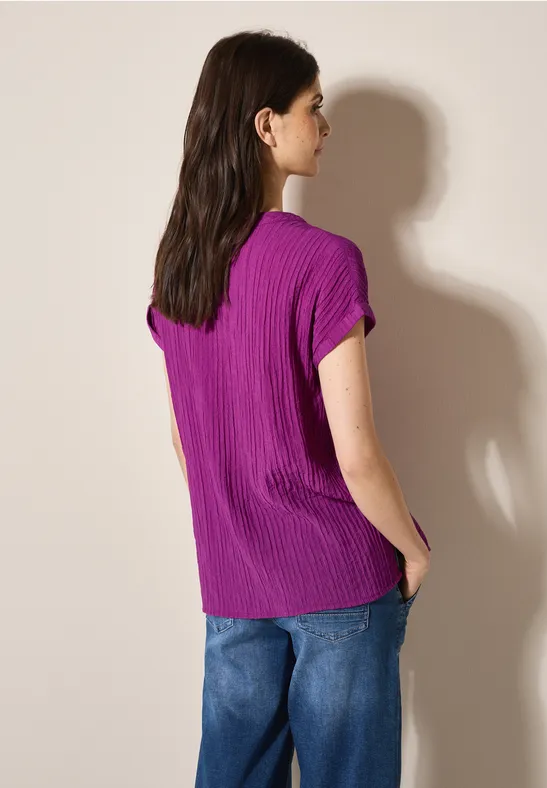 Lockere Strukturbluse mit geschlitztem Ausschnitt