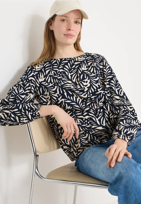 Bluse mit grafischem Blättermuster und Knotendetail