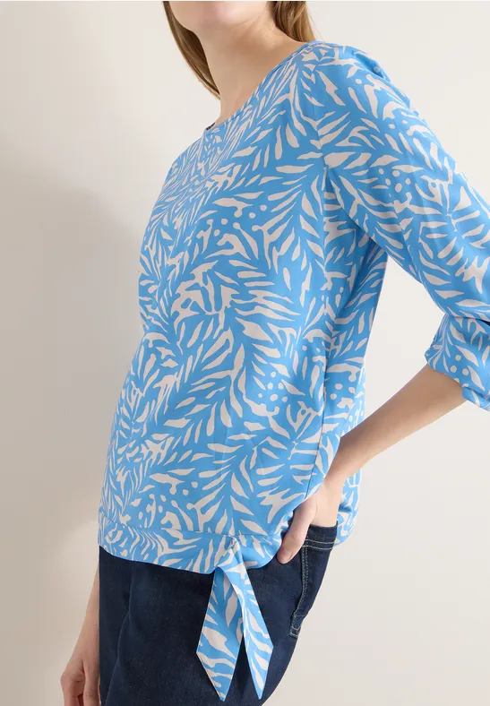 Bluse mit grafischem Blättermuster und Knotendetail