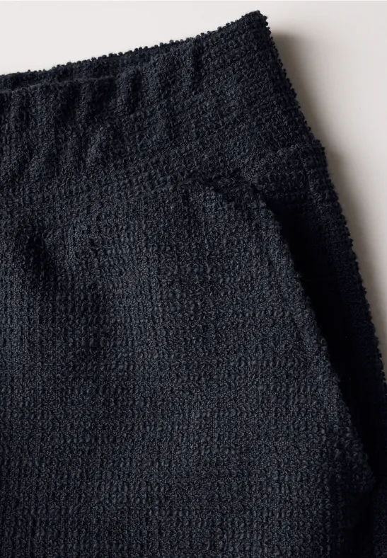 Weit geschnittene Bouclé-Strickhose