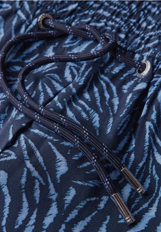 Schmal geschnittene Hose mit Grafikprint