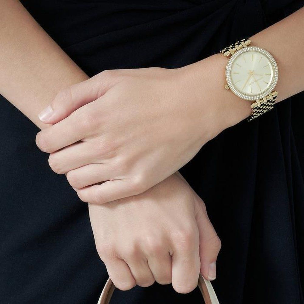 Goldfarbene Armbanduhr mit Kristallbesatz
