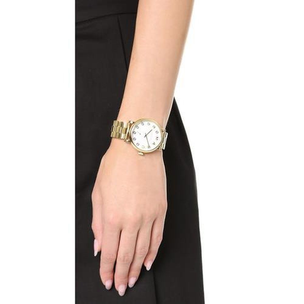 Goldfarbene Gliederuhr mit Kristall-Indizes