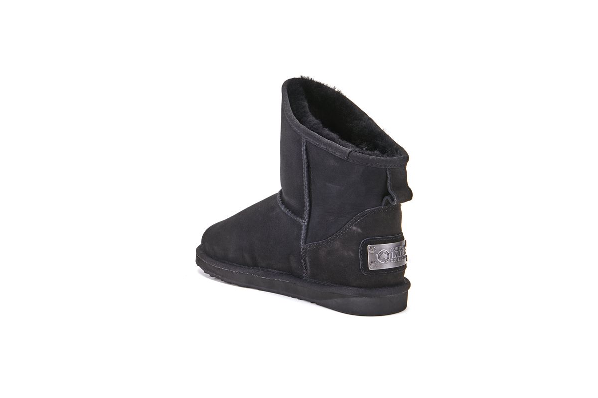 Kurze asymmetrische Lammfellstiefel
