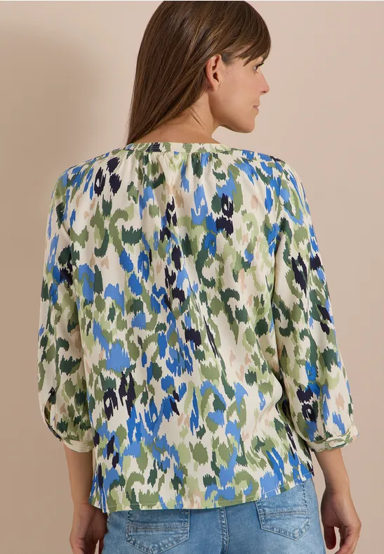 Bluse mit abstraktem Muster und Schlitz-Ausschnitt