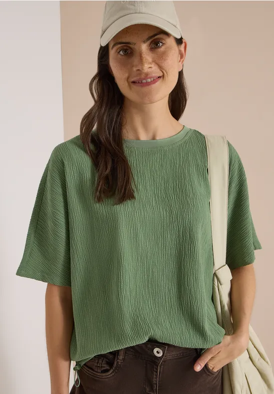 Strukturiertes Blusenshirt mit überschnittenen Schultern