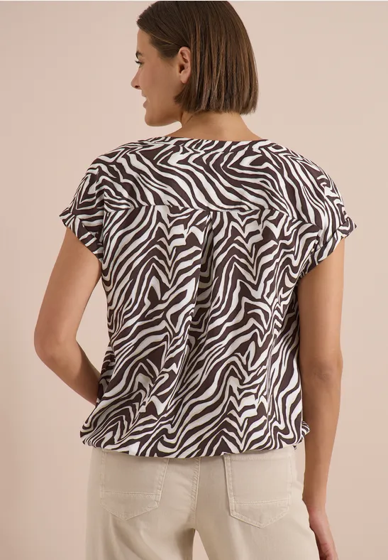Bluse mit abstraktem Zebramuster und Split-Neck