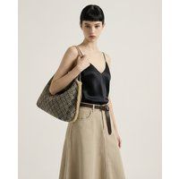 Geometrische Tasche mit Kunstfell-Besatz