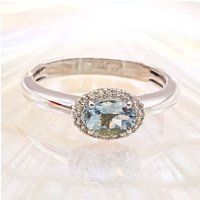 Aquamarin-Diamantring mit Halo-Schliff