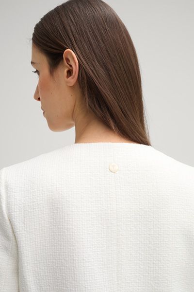 Kragenlose Bouclé-Jacke mit Fransen
