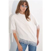 Asymmetrische Strickbluse mit Spitzenbesatz