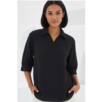 Locker geschnittene Bluse mit Polokragen