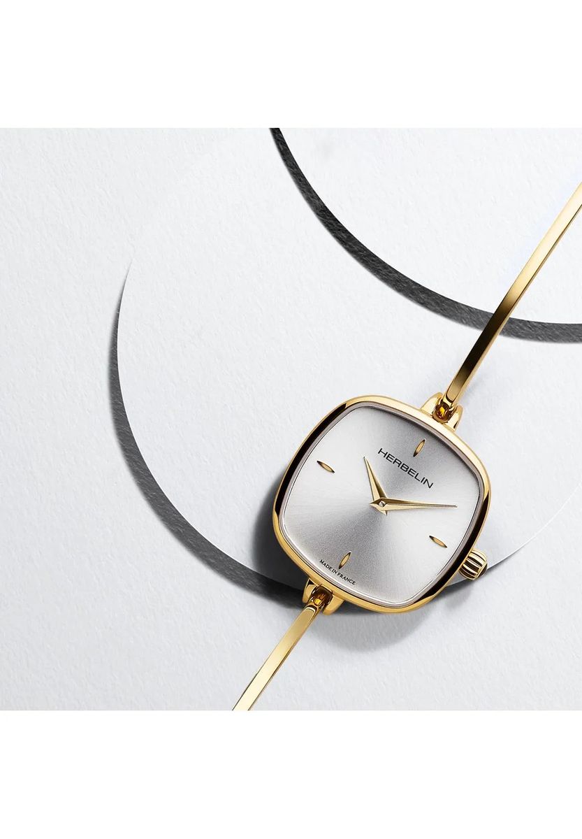 Elegante goldene Armreif-Uhr