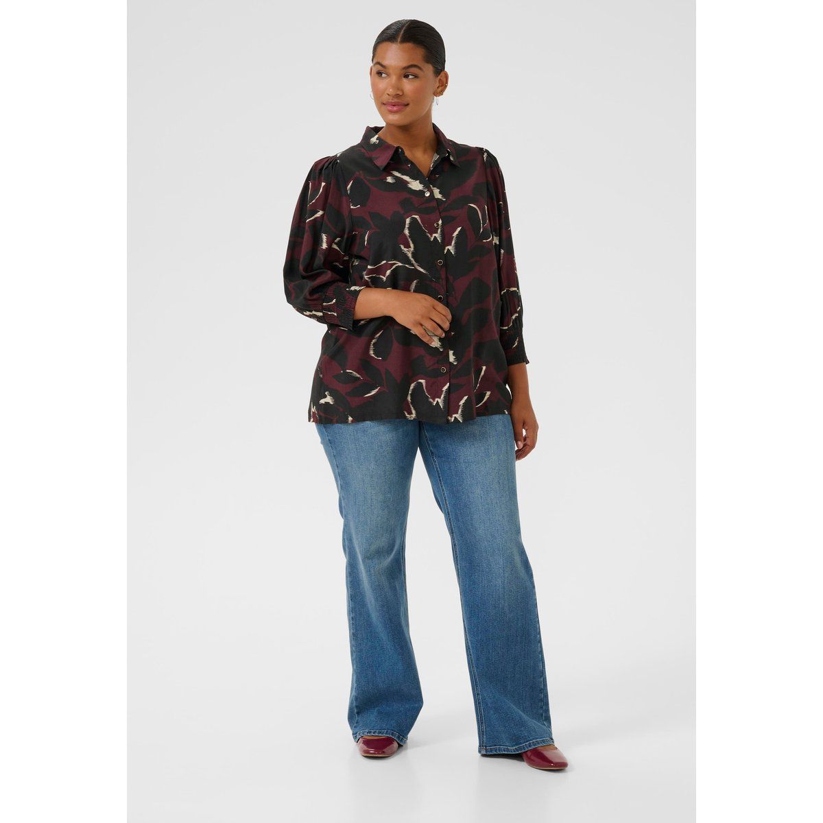 Bluse mit abstraktem Print und gerafften Bündchen