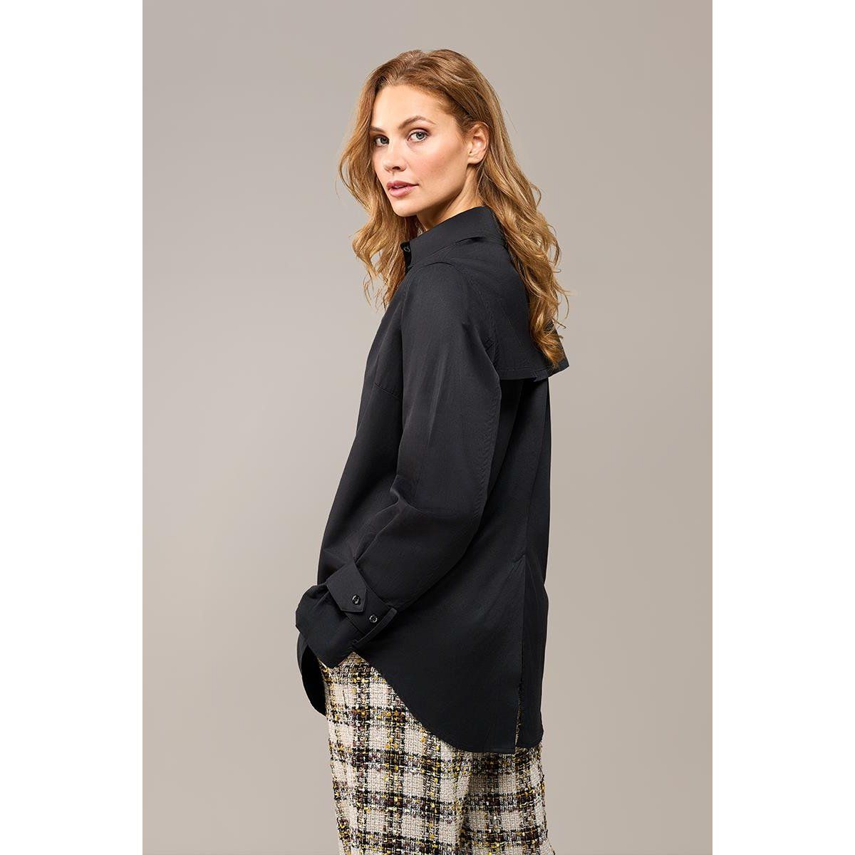 Elegante Bluse mit architektonischen Manschetten
