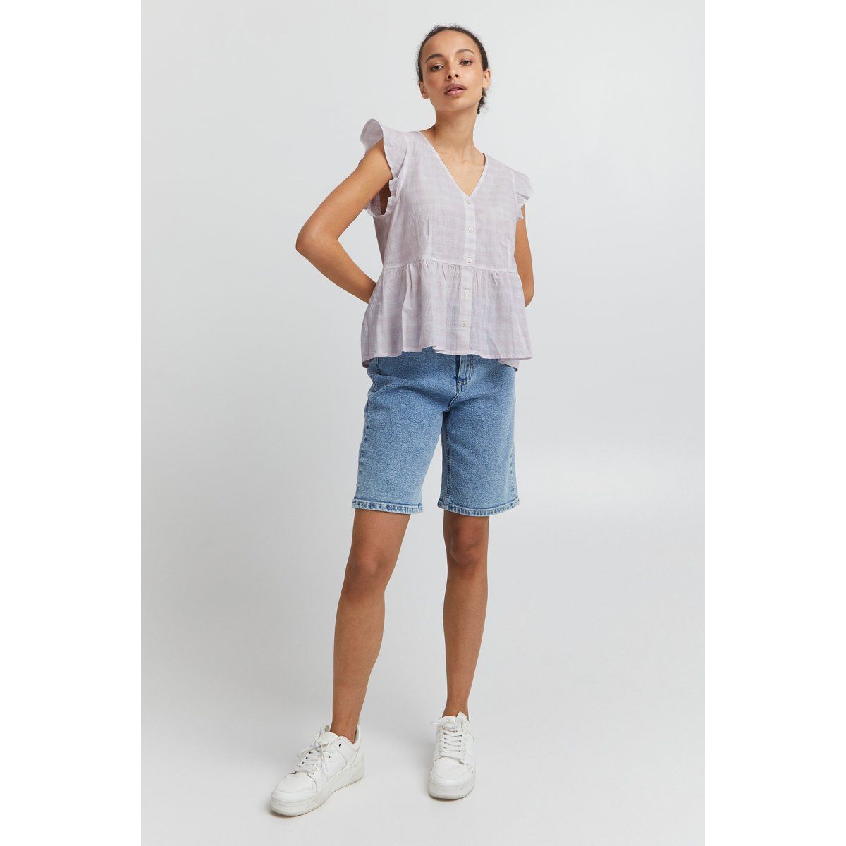 Ärmellose Schößchenbluse mit Volants